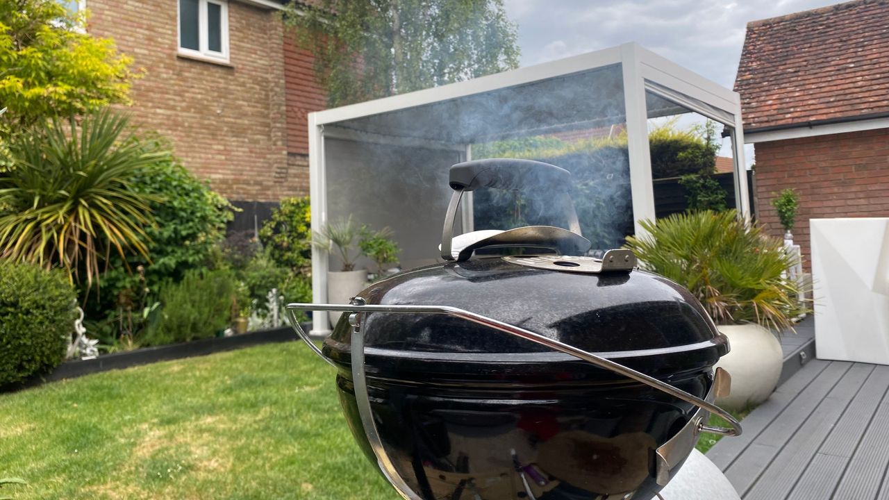 Weber Smokey Joe bbq in garden with lid on