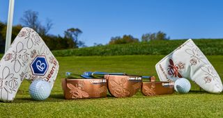 A group shot of the Queen B series of Bettinardi putters
