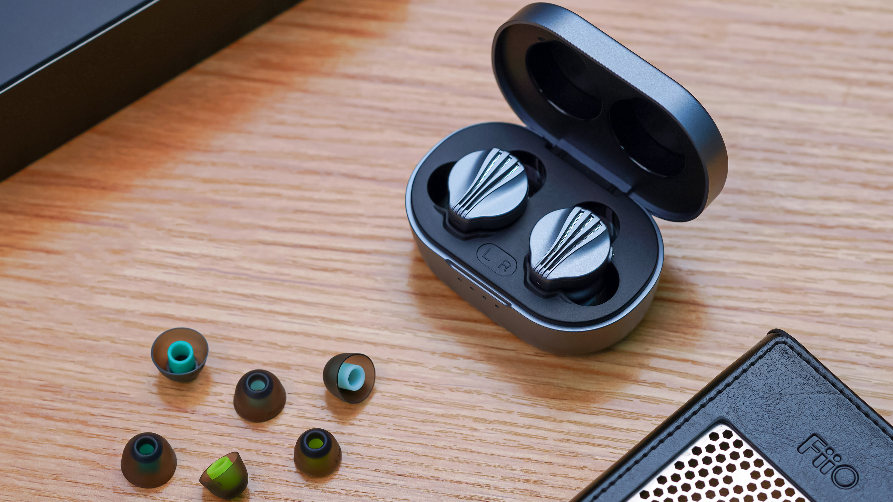 Fiio FW3 earbuds on a table