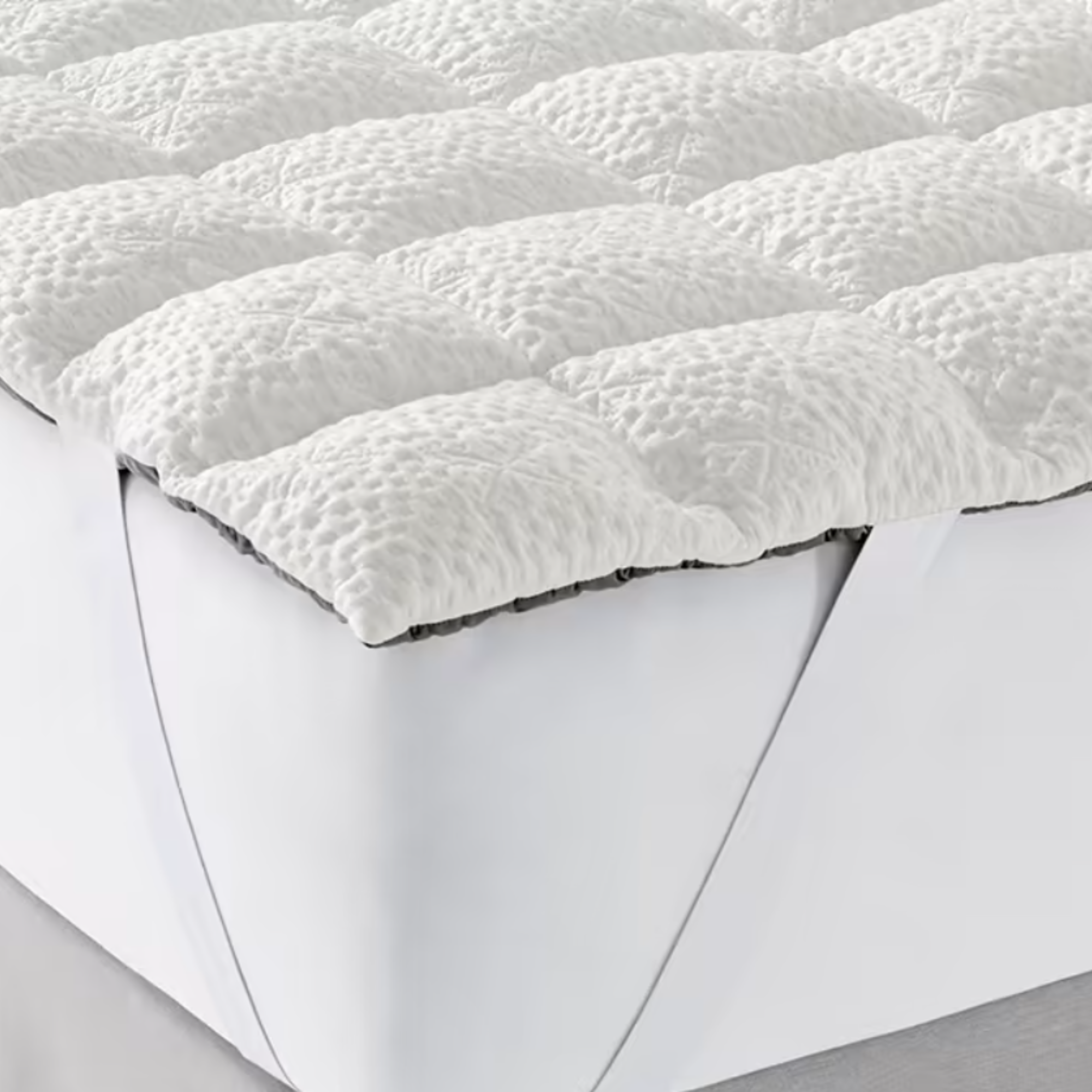 a mattress topper on a bed