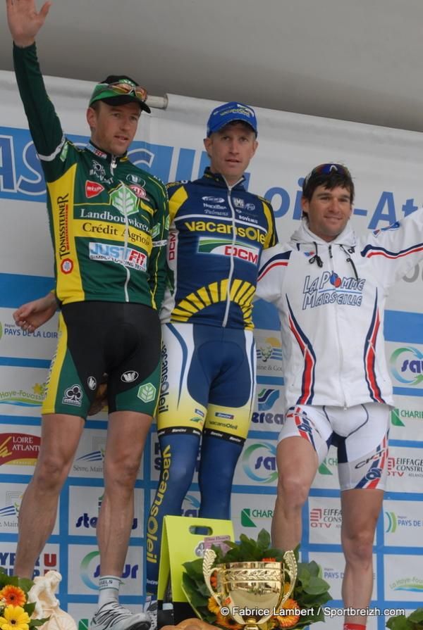 Westra is flanked by Scheirlinckx and Cauquil on the podium.