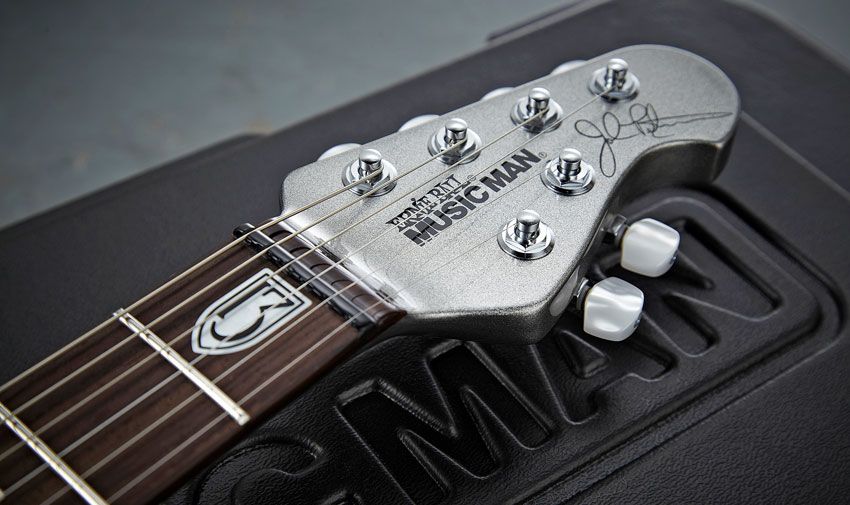 The guitar features Music Man's familiar compact 'four-and-two' headstock