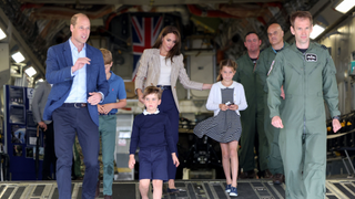 Britain's Prince Louis of Wales (centre left), Britain's Princess Charlotte of Wales (centre right), Britain's Prince George of Wales (2L), Britain's Catherine, Princess of Wales (C) and Britain's Prince William, Prince of Wales (L) walk down the ramp of a C17 during a visit to the Air Tattoo at RAF Fairford on July 14, 2023 in Fairford, central England