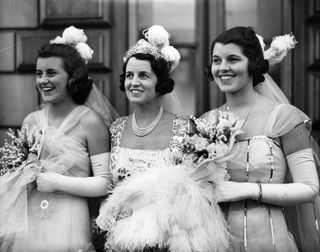 Rose Kennedy (center), with daughters Kathleen and Rosemary (right), leaving to be presented at Court, May 11, 1938.