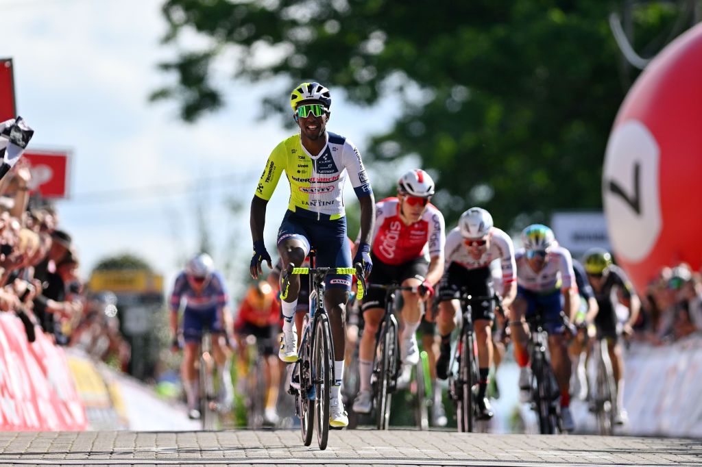 MONTDELENCLUS BELGIUM MAY 29 Biniam Girmay of Eritrea and Team IntermarcheWanty celebrates at finish line as race winner during the 83rd Circuit FrancoBelge 2024 a 1906km one day race from Tournai to MontdelEnclus on May 29 2024 in MontdelEnclus Belgium Photo by Luc ClaessenGetty Images