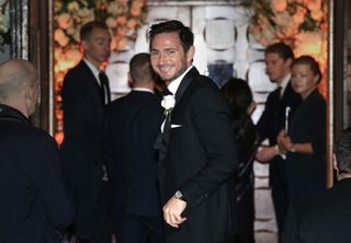 Frank Lampard waves as he arrives at the wedding