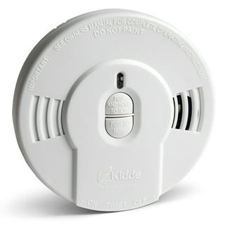 A white circular fire alarm 