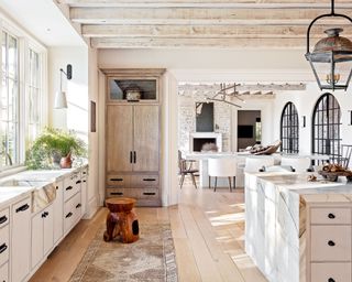 White country style kitchen with Calacatta marble worktops and white island