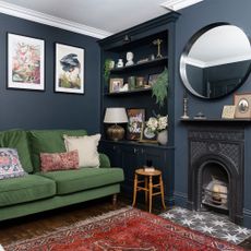 dark blue living room with green sofa