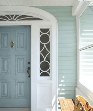 Exterior painted in Wedgewood Gray with door in Van Courtland Blue