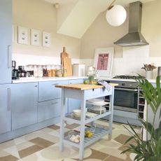 blue kitchen with ikea trolley island