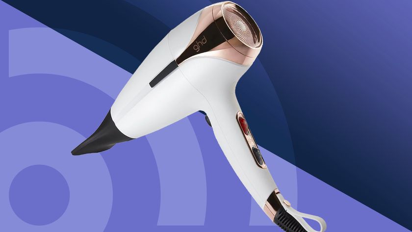 The best hair dryer, the GHD Helios, on a purple background