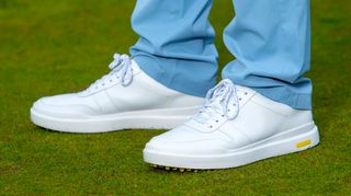 The stunning white Cole Haan GrandPro AM Golf Shoes on the golf course