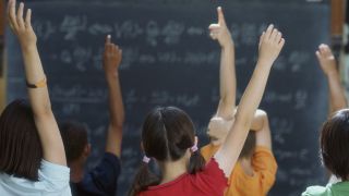 Students raising hands