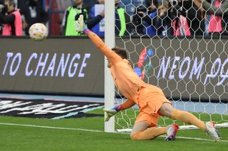 Barcelona's German goalkeeper Marc-Andre ter Stegen dives to save the ball during the penalties shootout during the Spanish Super Cup semi-final football match between Real Betis and FC Barcelona at the King Fahd International Stadium in Riyadh, Saudi Arabia, on January 12, 2023.