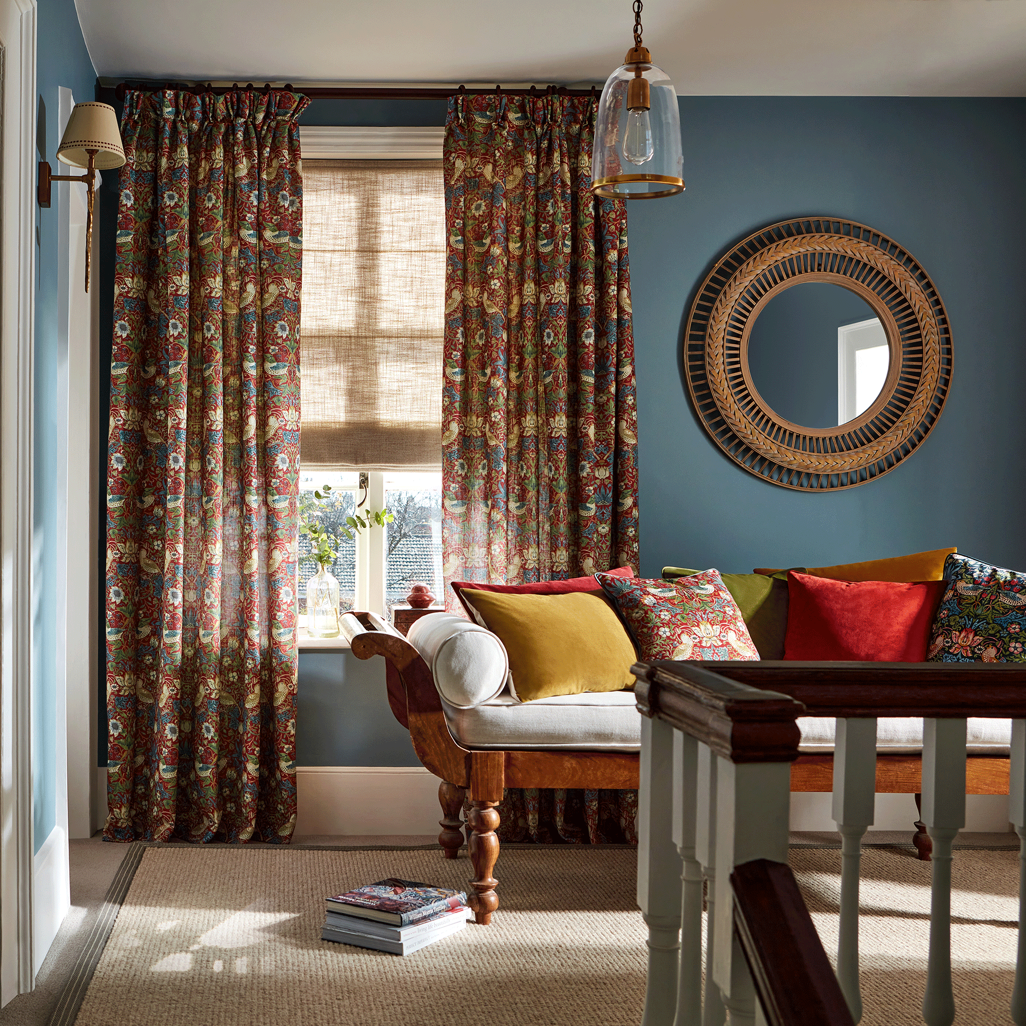 Red Morris & Co curtains with navy blue walls
