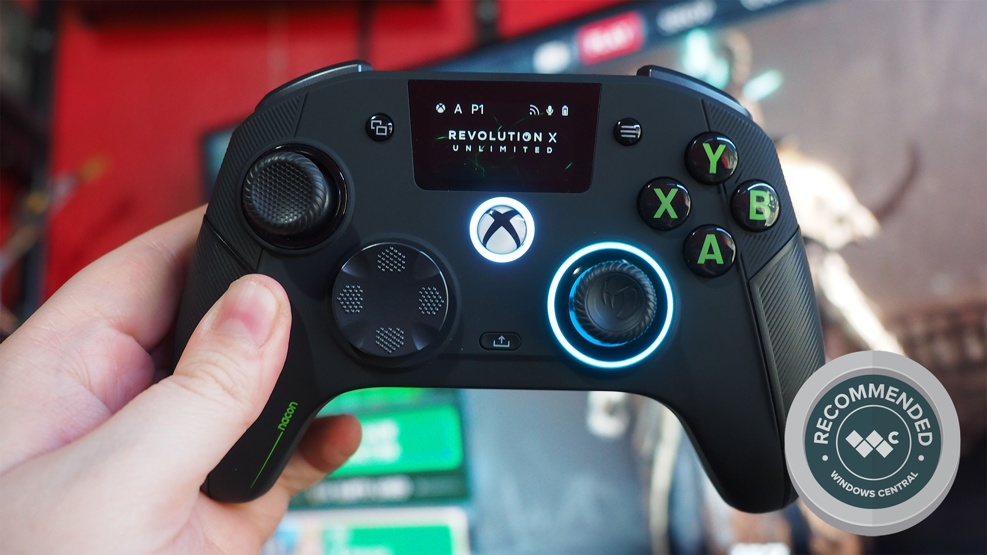 Nacon Revolution X Unlimited Xbox Controller held in hand with &#039;Recommended&#039; award badge from Windows Central