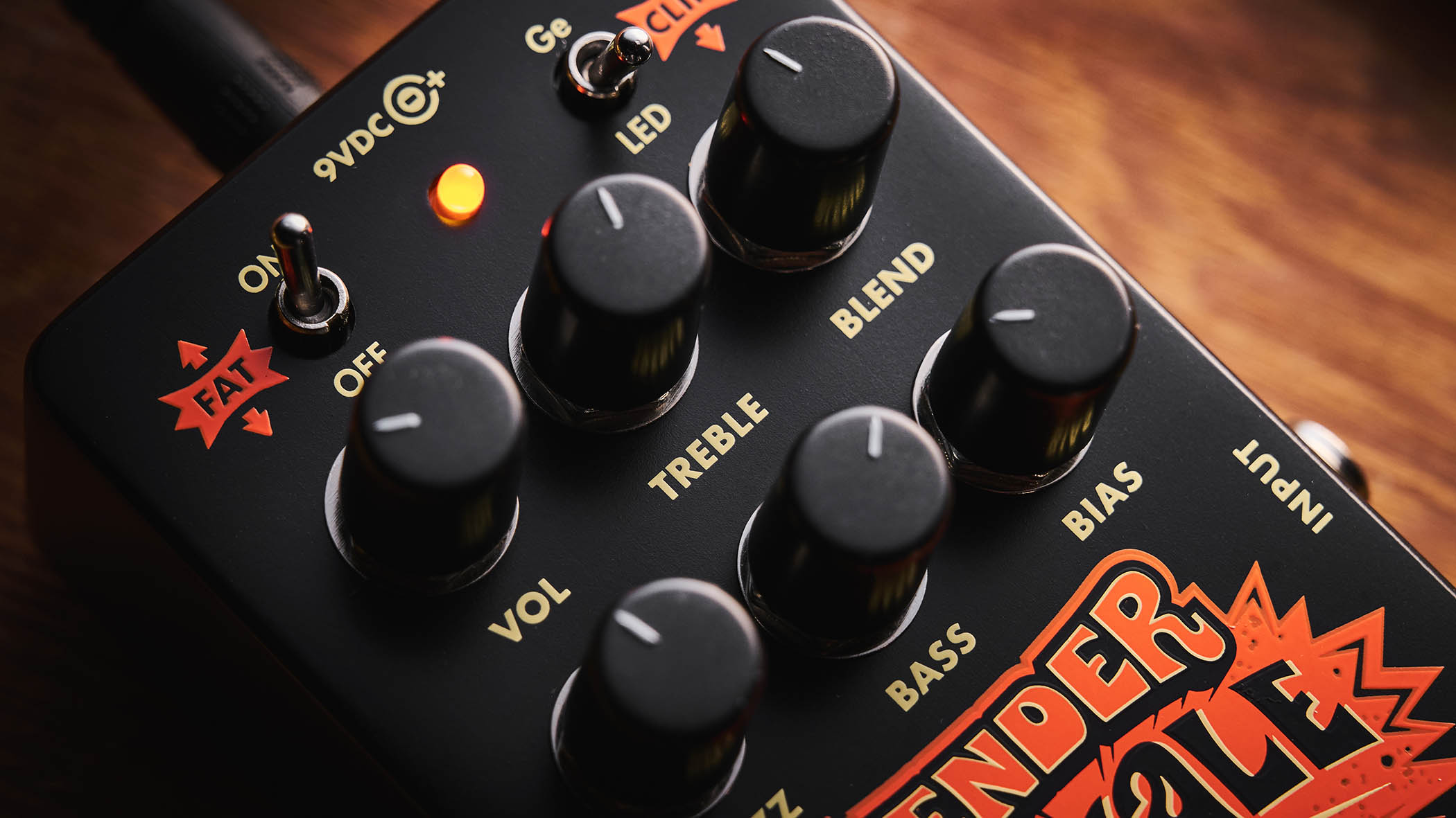 Electro-Harmonix Bender Royale &amp;ndash; the feature-packed fuzz pedal is finished in a black enclosure with orange graphics/text, and is photographed here in warm tones against a wooden background.