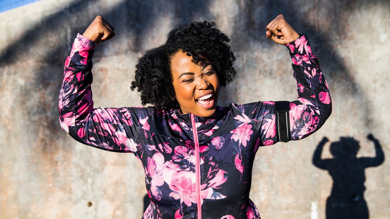 Funny portrait of a young black curvy woman during a training session