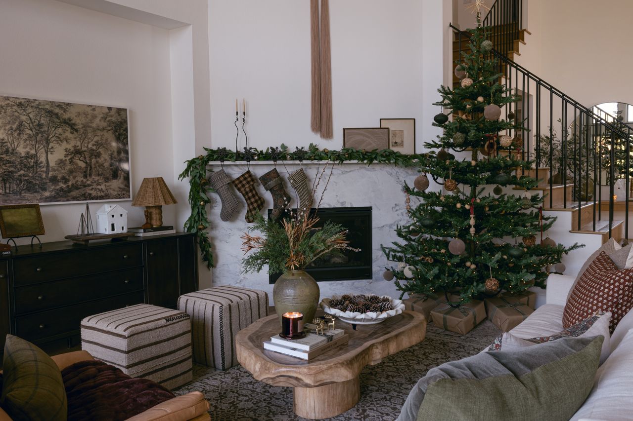 a living room with a christmas tree 