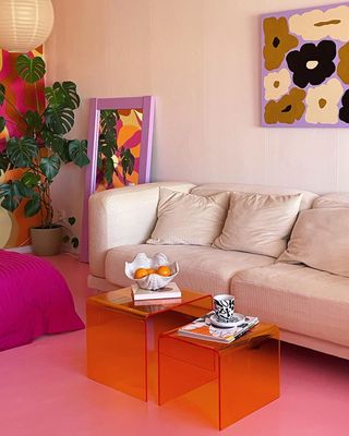 Colorful living room with orange coffee tables