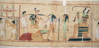 Scene from the Book of the Dead showing the ibis-headed god Thoth recording the result of the final judgement.
