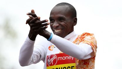 Kenyan athlete Eliud Kipchoge celebrates his victory in the men’s elite race at the 2019 London Marathon