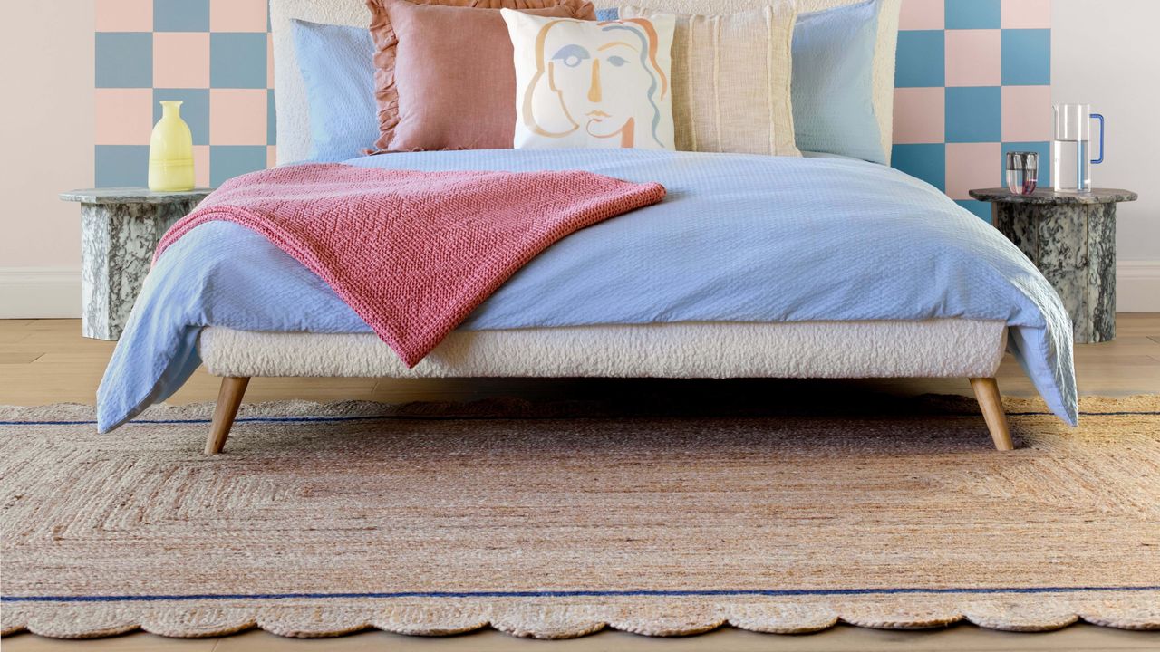 Bedroom with scallop jute rug and pastel coloured bedding