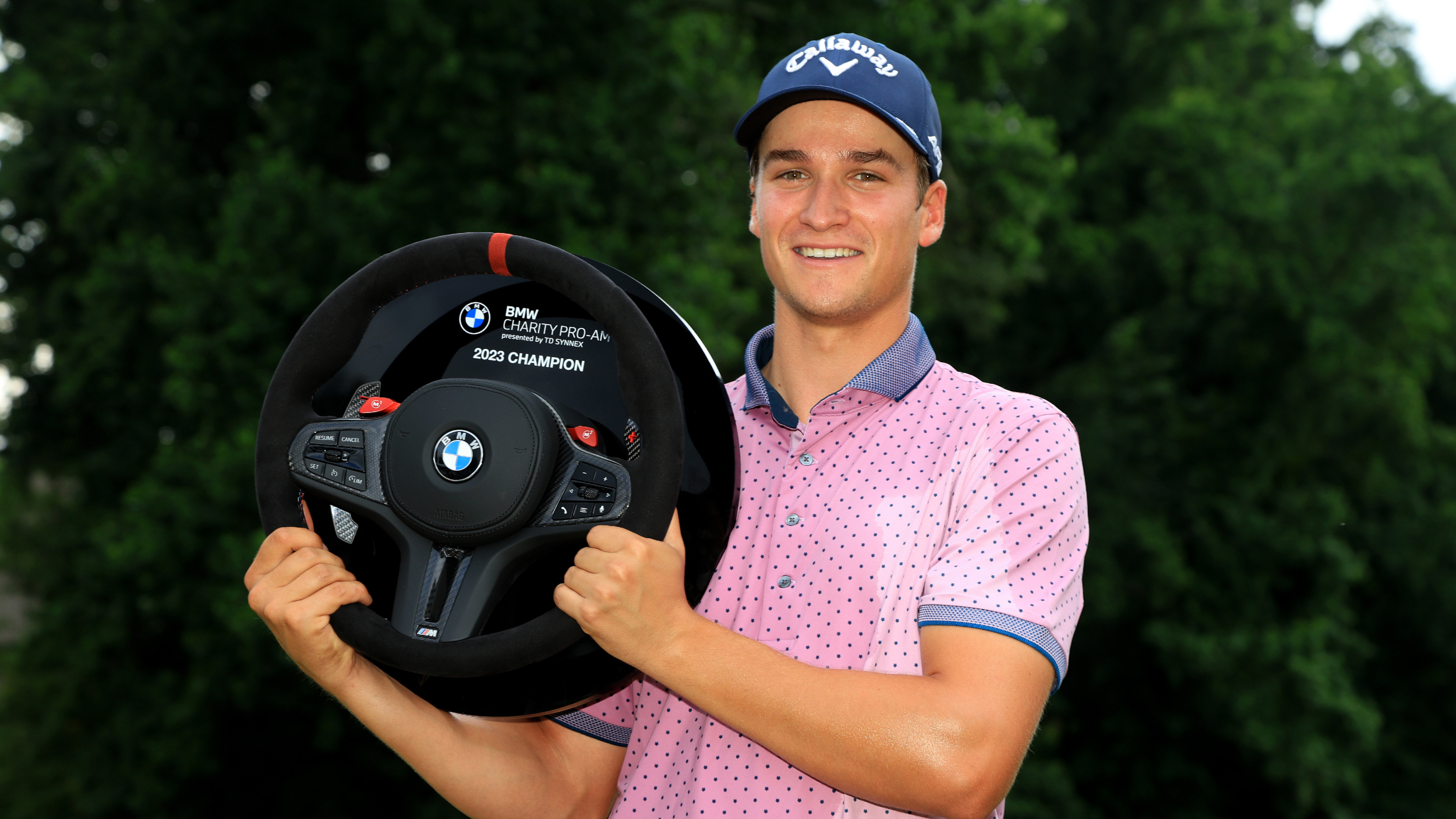 Adrien Dumont de Chassart poses with the trophy after winning the BMW Charity Pro-Am