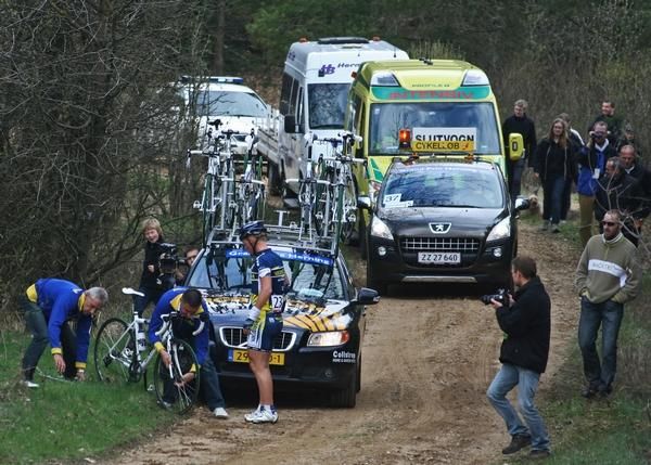 A waiting Bobby Traksel, Vacansoleil on the second Gravel road after giving his wheel to a teammate