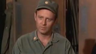 Larry Linville as Frank Burns, looking annoyed and wearing military garb