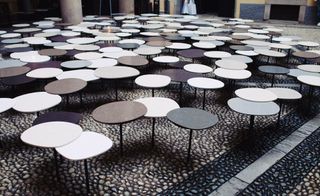 versatile arrangement of one-legged tables
