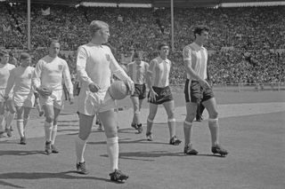 Bobby Moore and Antonio Rattin lead out England and Argentina at the 1966 World Cup.