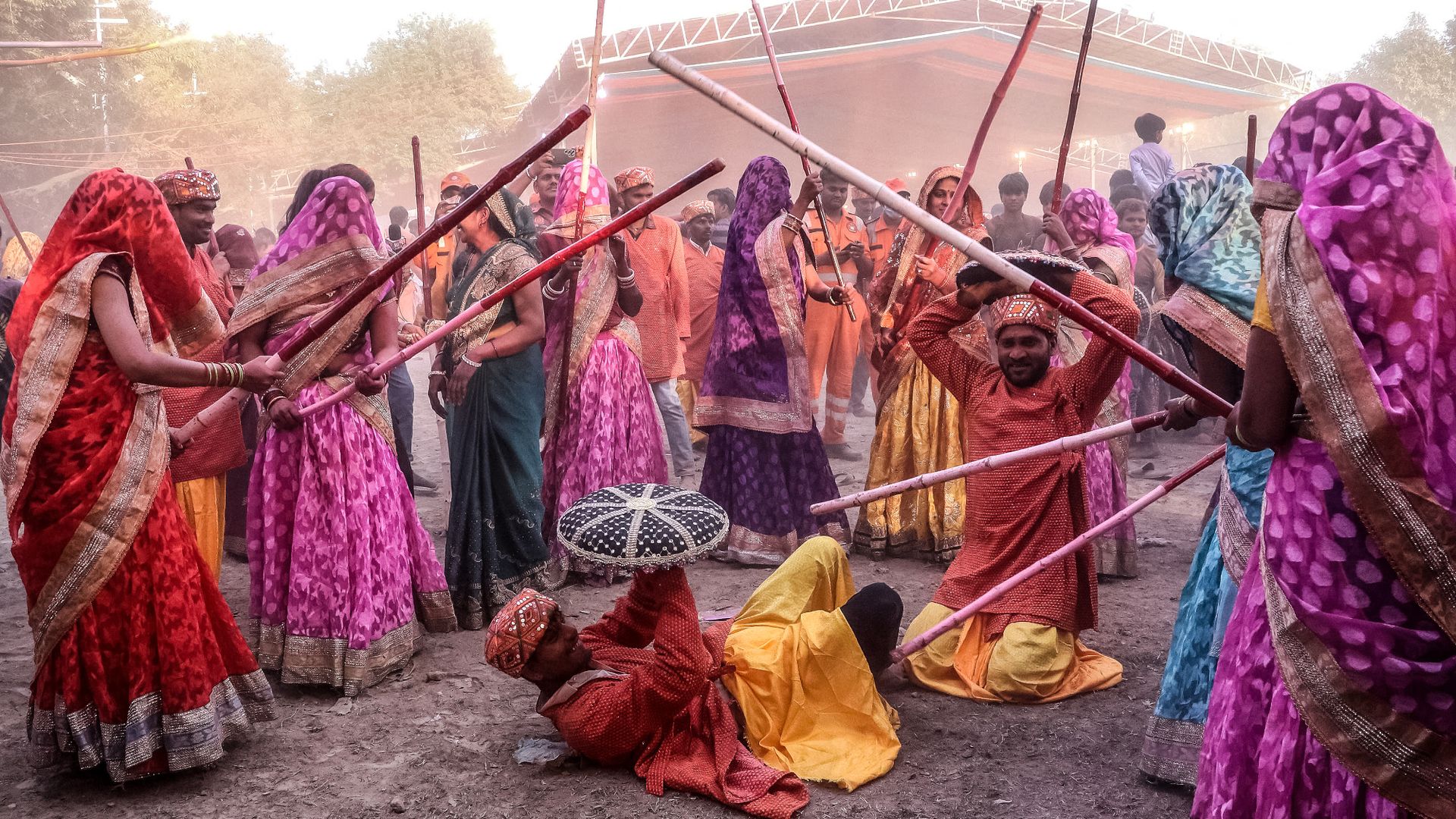 
                                Women playfully hit men with sticks during the Holi celebrations in Mathura, India
                            