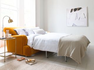 Yellow velvet sofa bed