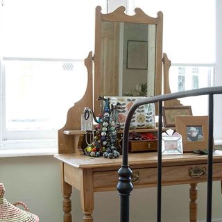 wooden dressing table with mirror and photo frame