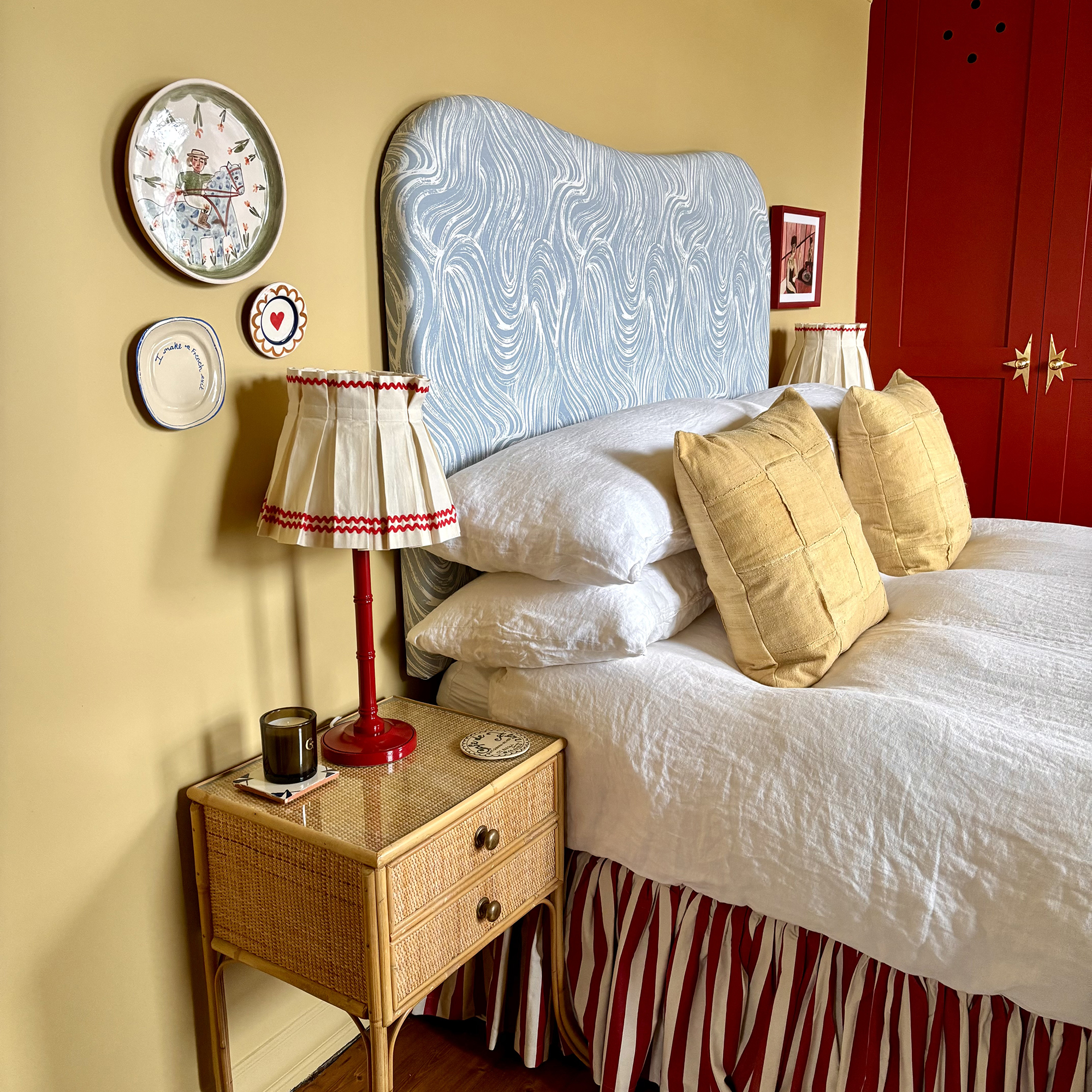 yellow bedroom with blue headboard