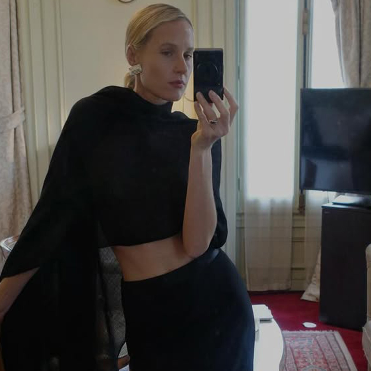 Elly McGaw wearing a black poncho.