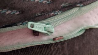 Close up of the Tuft & Needle Mint Hybrid mattress's zip fastener
