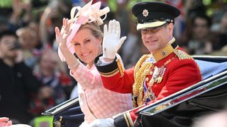 Prince Edward, Earl of Wessex, and Sophie, Countess of Wessex, travel in a horse-drawn carriage during Trooping The Colour