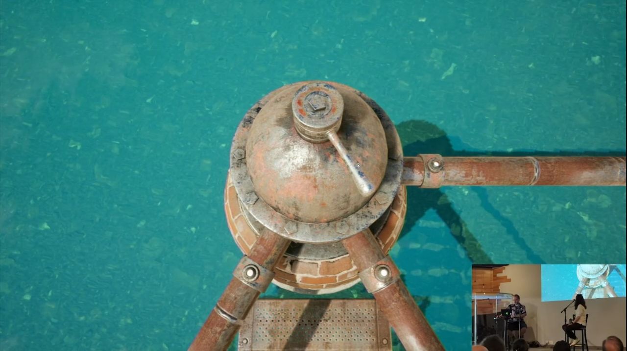on-stream view of gameplay from the remake of Riven: The Sequel to Myst, showing a boiler on the shore of a crater lake with scaffolding going out into the middle of the lake