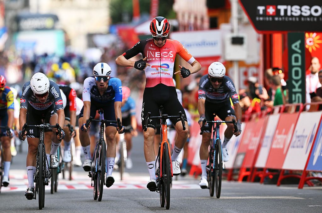 VOIRON, FRANCE - AUGUST 26: Ben Turner of Great Britain and Team INEOS Grenadiers celebrates at finish line as stage winner ahead of Jasper Philipsen of Belgium and Team Alpecin - Deceuninck (L) during the La Vuelta - 80th Tour of Spain 2025, Stage 4 a 206.7km stage from Susa to Voiron / #UCIWT / on August 26, 2025 in Voiron, France. (Photo by Dario Belingheri/Getty Images)