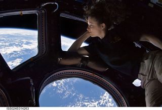 The International Space Station's Cupola gives crew members a 360-degree view around the orbiting complex through six trapezoid-shaped windows and one large, circular viewing port.