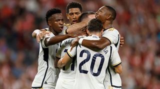 Vinicius Junior and Jude Bellingham celebrate with Rodrygo after the Brazilian's goal against Athletic Club in LaLiga in August 2023.