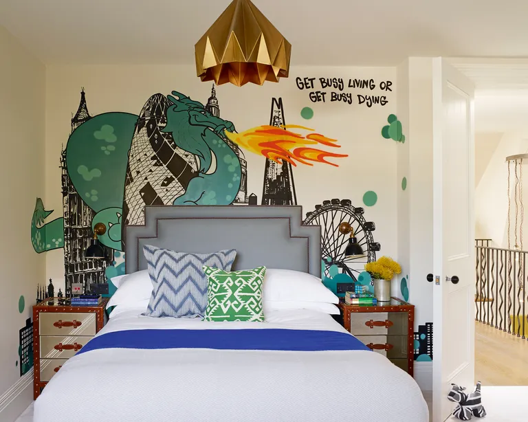 Kids room paint ideas with graffiti-style mural depicting the London skyline and a fire-breathing dragon
