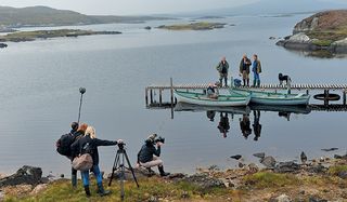 A scene from Central Casting: gillie Donald, The Boss, The Prof and the Laird prepare to launch on the loch.