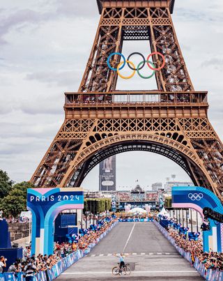 Paris, France - Men’s Road Race - Remco Evenepoel (Belgium) celebrates winning the Men's Road Race to become Olympic Champion in front of The Eiffel Tower