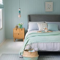 Neutral and light blue bedroom colour scheme with bedside table