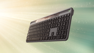 The Logitech Signature Slim Solar+ K980 Keyboard floats, sparkling, in a sunny void.