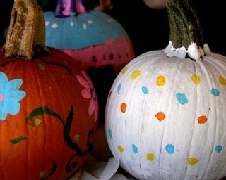 pumpkins painted with polka dots and flowers